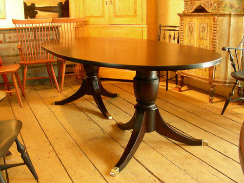 Oval Shape Table With Sabre Leg Pedestals