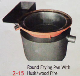 Round Frying Pan With Husk And Wood Fire