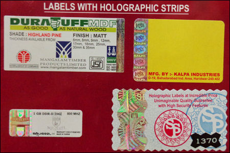 Labels With Holographic Strips