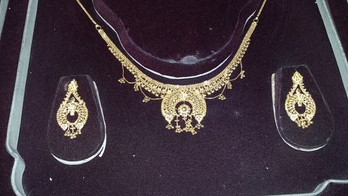 Designer Gold Necklace And Earrings Set