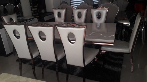 Italian Dining Table - Italian Marble Finish, Surrounded by Elegant Gold Steel Chairs, Eye-Catching Design