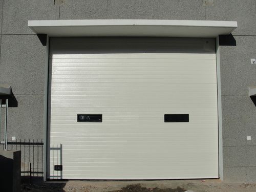 Industrial Overhead Sectional Door - Double Wall Insulated Polyurethane, Suitable for Garage and Industrial Use, Manual Operation During Power Failures, Complete Seal with Rubber Gasket