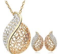 Gold Plated Studded Pendant With Matching Earrings