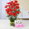 Red Gerberas in a Glass Vase with Round Strawberry Cake (Eggless