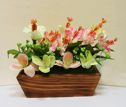 Artificial Flowers In A Wooden Vase