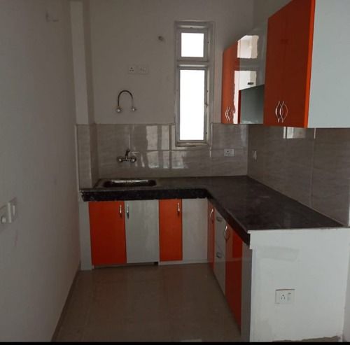 Orange And White L Shape Modular Kitchen