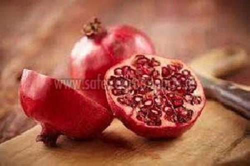 Fresh Pomegranate In Wooden Box