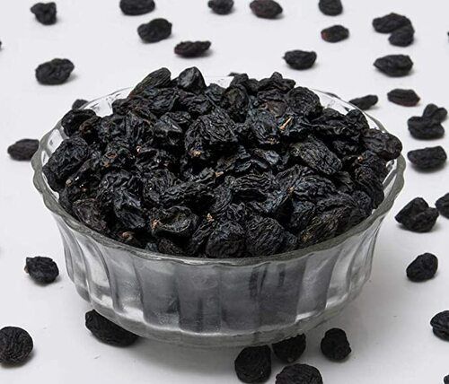 Natural Dried Black Raisins - Food Grade, Sweet Taste, Soft Texture, Rich In Protein, Non Glutinous, Organic Variety, Elongated Shape, Sunlight Dried, Standard Size, 12 Month Shelf Life