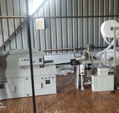 sanitary napkin making machine