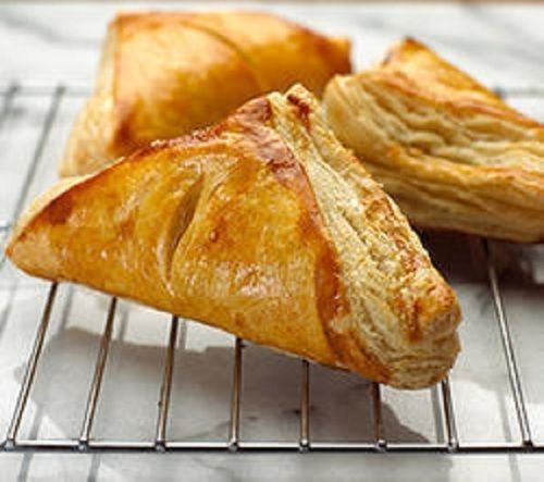 Cheese Baked Pastry, Finest Quality, Fresh, Pure And Hygienic, Rich In Taste, Scrumptious Flavor, Pleasing Aroma, Free From Impurities, Triangle Shape, Brown Color