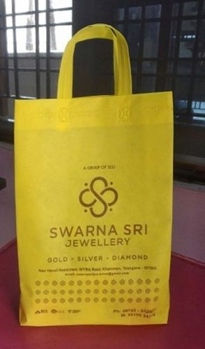 Non Woven Yellow Printed Loop Handle Bag, Capacity 3 Kg, Size 12" X 14" X 5" Bag Size: 12X14X4 Inch