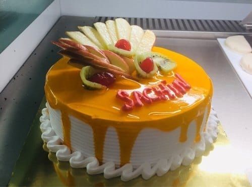 Cream Designer Yellow Fruit Cake Are Creamy Moist And Filled With Seasonal Fruits