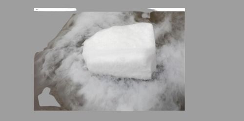 Dry Ice Evaporates In The Water. Steam From A Large Piece Of Ice. Chemical Experiment. Distribution Of Fog Over Packaging: Can (Tinned)