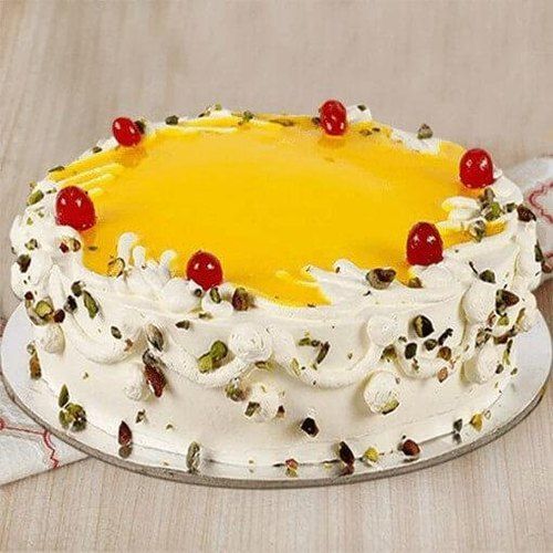 Delicious And Creamy Pineapple Round Pista Cream Cake For Birthdays And Parties