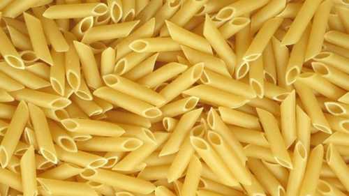 Easy To Eat And Easy To Make Light Yellow Raw Pasta Packed In Plastic Bags