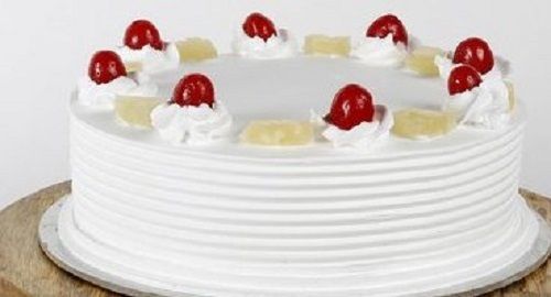 White Color Pineapple Fresh And Sweet Taste Cake With Cherry And Pineapple Toppings