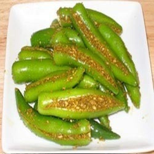 Round Tasty And Salty Spicy Green Chilli Pickle 150 Grams