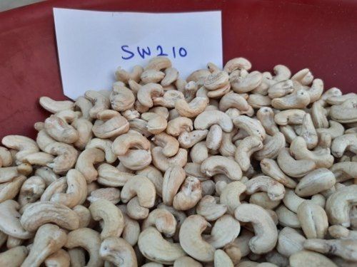 Natural Steamed Jumbo Sw210 Scorched Cashew Kernels (Indian Origin), 10 Kg Tin Packing