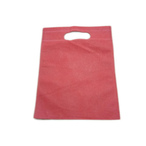  प्लेन पिंक (गुलाबी) रंग और डी कट नॉन वोवन कैरी बैग हाई वेट बेयरिंग क्षमता के साथ 