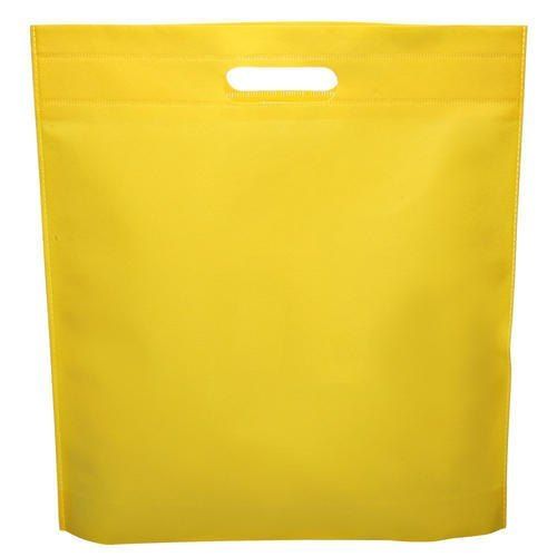  दैनिक खरीदारी के उपयोग के लिए पीले रंग के सादे रंग के गैर बुने हुए डी कट बैग 