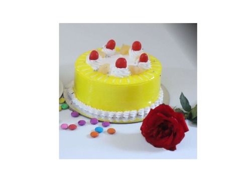 1 Kg Mango Flavored Cake, Topped With Cream And Cherry For Any Occasion