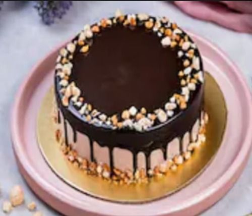 1 Kg Round Shape Chocolate Cake, Topped With Melting Chocolate And Choco Chips