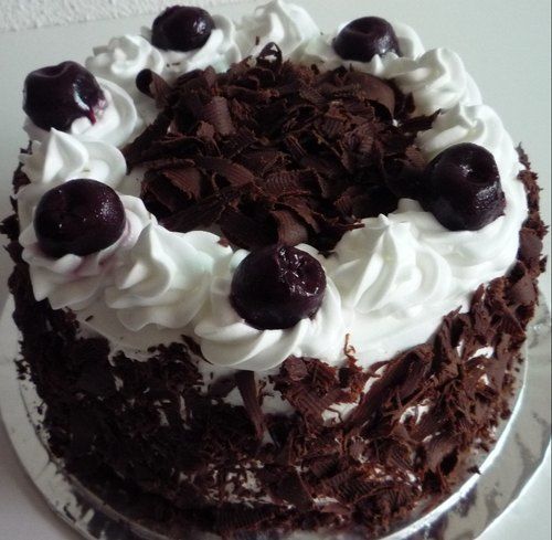 Tasty Delicious Mouth Watering Vanilla And Black Forest Cake With Chocolate Topping 
