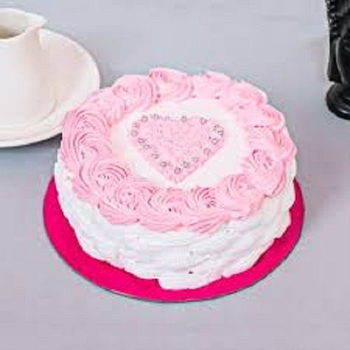 Tasty And Sweet Mouth Melting Rounded Cake Decorated With Heart Shape For Birthday Parties