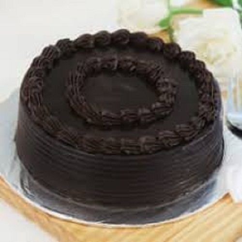 Tasty And Sweet Mouth Mounting Rounded Shape Chocolate Cake With For Birthday Parties