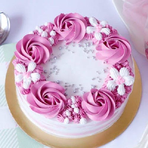 Elegant Look Dreamy Creamy Delicious And Testy Pineapple Eggless Cake Pink Flower Topping