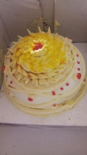 100 Percent Egg Less And Fresh Baked Vanilla Cake With Yellow Flower Design