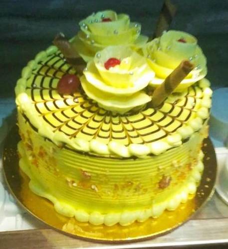 100 Percent Fresh Butterscotch Cake With Choco Stick And Flower Design Topping 