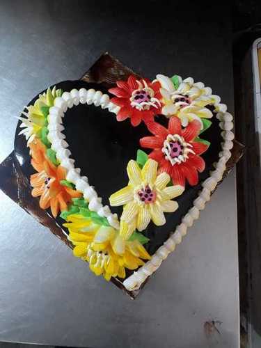 Tasty And Delicious Heart Shape Chocolate Cake With Flower Design For Birthday Party