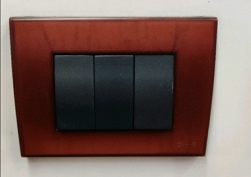 Reasonable Rates, Superior Performance and Reliable Black And Brown Modular Switch - Plastic Material, 6A & 16A Size, Black Color | Versatile Use for High Traffic Areas, 15A Max Current, 50/55Â°C Operating Temperature, 24/7 Support