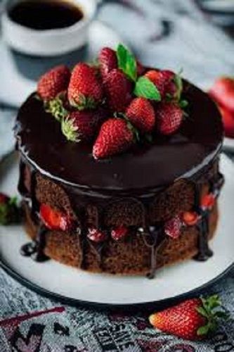 Mouth Watering And Delicious Tasty Smooth Soft Fluffy Strawberry Topped Chocolate Round Cake 