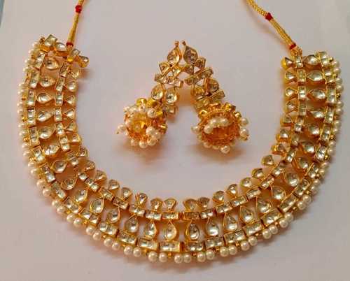 Gold Charm Necklace Set With Two Earrings For Party Wear