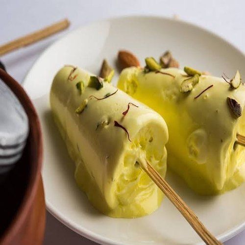 Yellow Conical Shape Additional Ingredient Rosewater Mango Pista Flavor Fat Contains 0.3 Gram Kulfi Ice Cream