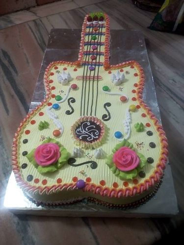 100 Percent Eggless Creamy Guitar Shaped Butterscotch Cake