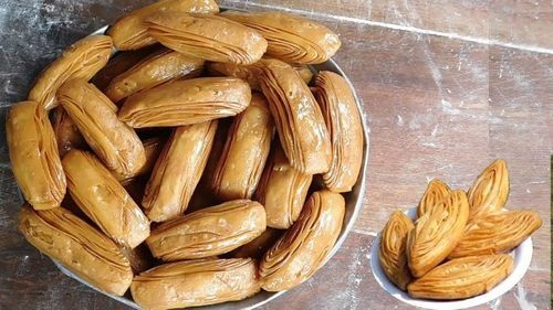 Indian Deep-Fried Pastry Socked With Sugar Sweet Khaja  Carbohydrate: 10 Grams (G)