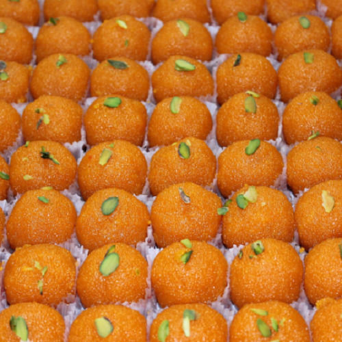 1 Kg Yellow Motichoor Laddu, Round Shape, Topped With Dry Fruit, Sweet And Tasty