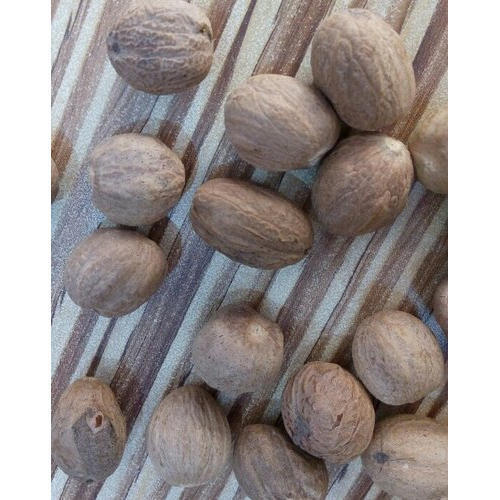 Brown Dried Round And Gluten Free Fresh And Organic And Healthy Natural Nutmeg 