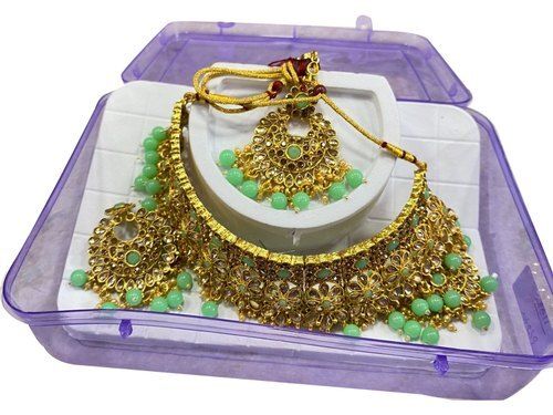Ladies Stone And Brass Golden Artificial Designer Necklace Set