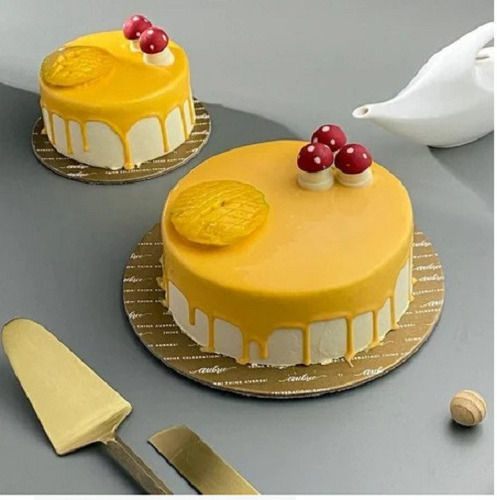 Yellow Color Round Shaped Eggless Sweet And Delicious Mango Cake With 1 Kg Weight  Fat Contains (%): 24 Percentage ( % )