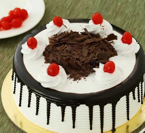 Fresh And Eggless Round Chocolate Flavored Black Forest Cake  Ingredients: Herbs