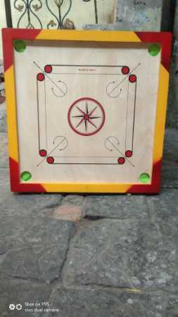 Wooden carrom board