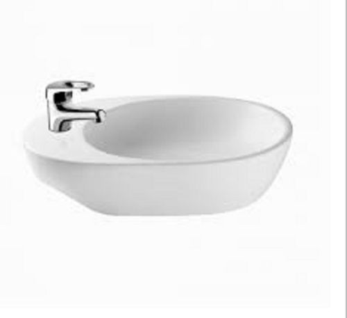 A Grade White Oval Shape Glossy Wash Basin In Size Of 44 X 31 X 11 Centimeters