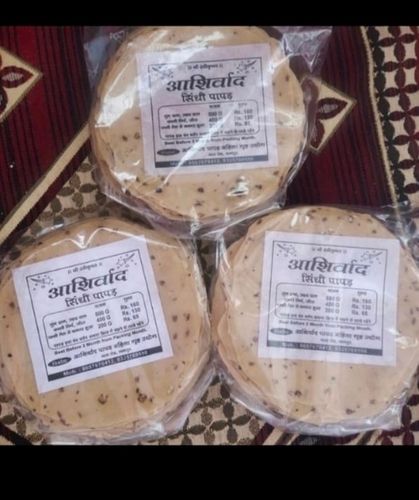 Round Shape Dried Sindhi Salty Papad Served With Dinner