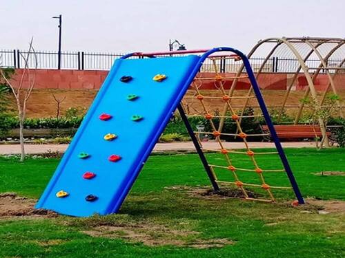 Outdoor Multi-Play Station With A Rock Climbing Wall And A Rope Net