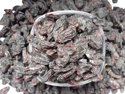 Super Black Raisin - 15 Kilograms, Black Color, Elongated Shape, Sunlight Dried, B Grade Quality, 5% Moisture, Sweet Taste, Standard Size