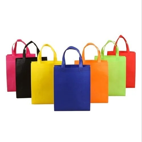 Non Woven Bag - PP Material, 10x12+4 Size, Multi Color, 5kg Capacity, 85 Thickness, Offset Printing, Embossed Finish, Handles Included